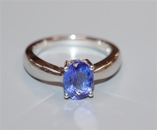 A modern Illana 18ct white gold and oval tanzanite ring, size O.